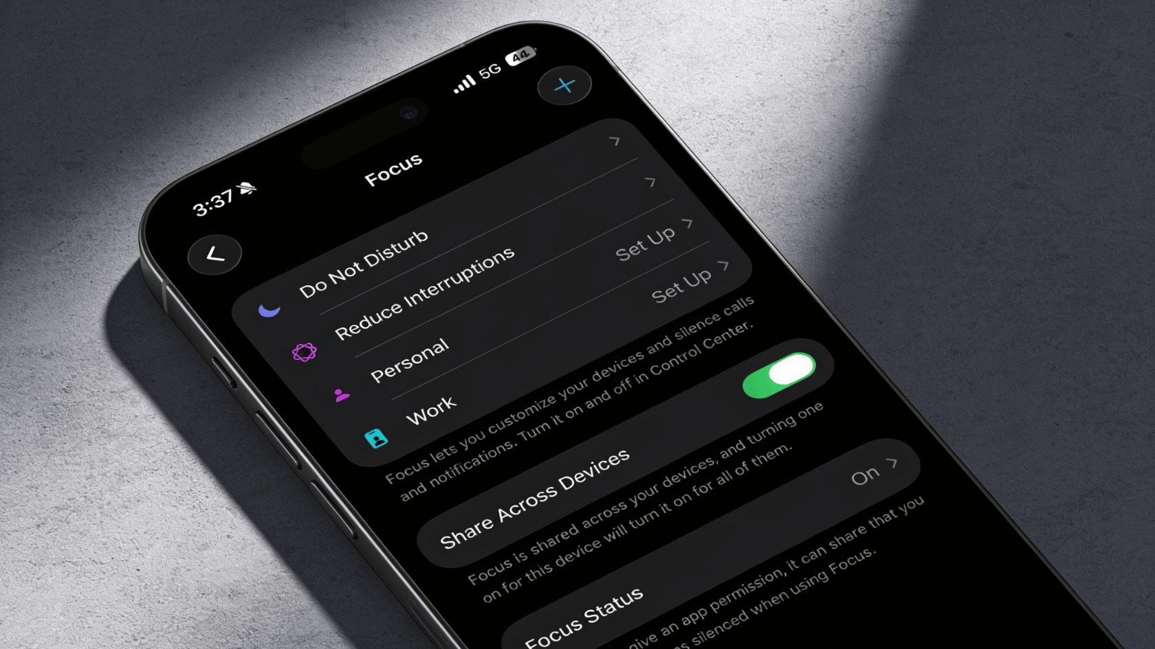 iPhone Focus settings with Do Not Disturb, Reduce Interruptions, Personal, Work, Share Across Devices, Focus Status toggle