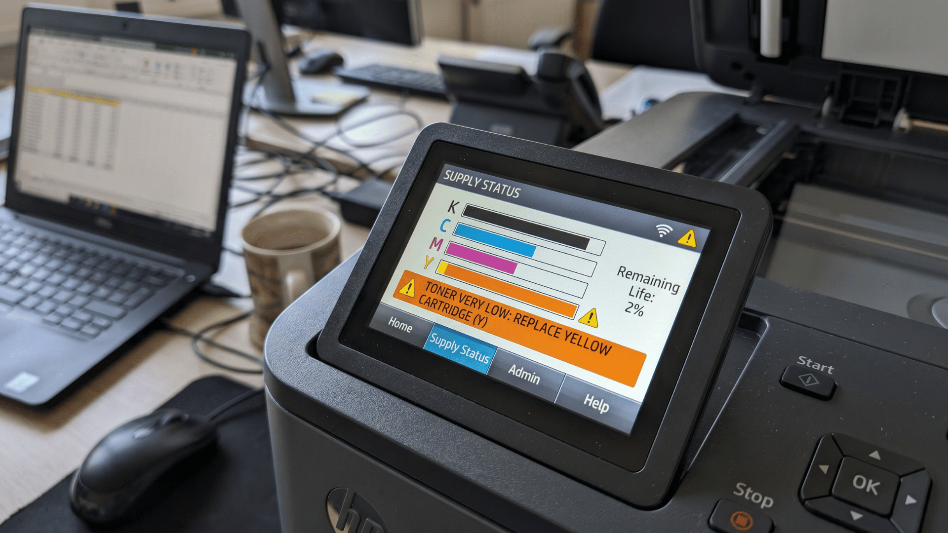 Printer display showing ink level indicators and cartridge status on control panel screen